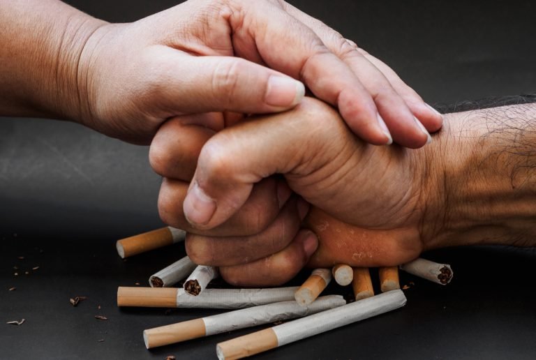 Man,Hand,And,Woman,Hand,Punching,And,Destroy,Cigarettes,On